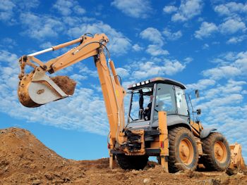 Bulldozer digging dirt in land development